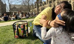 woman putting glasses on daughter