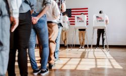 People standing at a polling booth