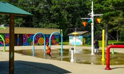 Two kids enjoying a splash pad