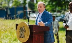 Detroit Mayor Mike Duggan speaking into the microphone