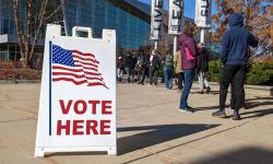 People walk into a voting location