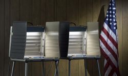 Voting booth and US flag