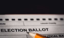  Selective focus on a generic election ballot with a pencil on top. 