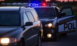 Highway Traffic Patrol Car Pulls over Vehicle on the Road