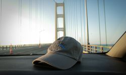 Bridge Michigan hat on the dashboard, Mackinac Bridge on the background